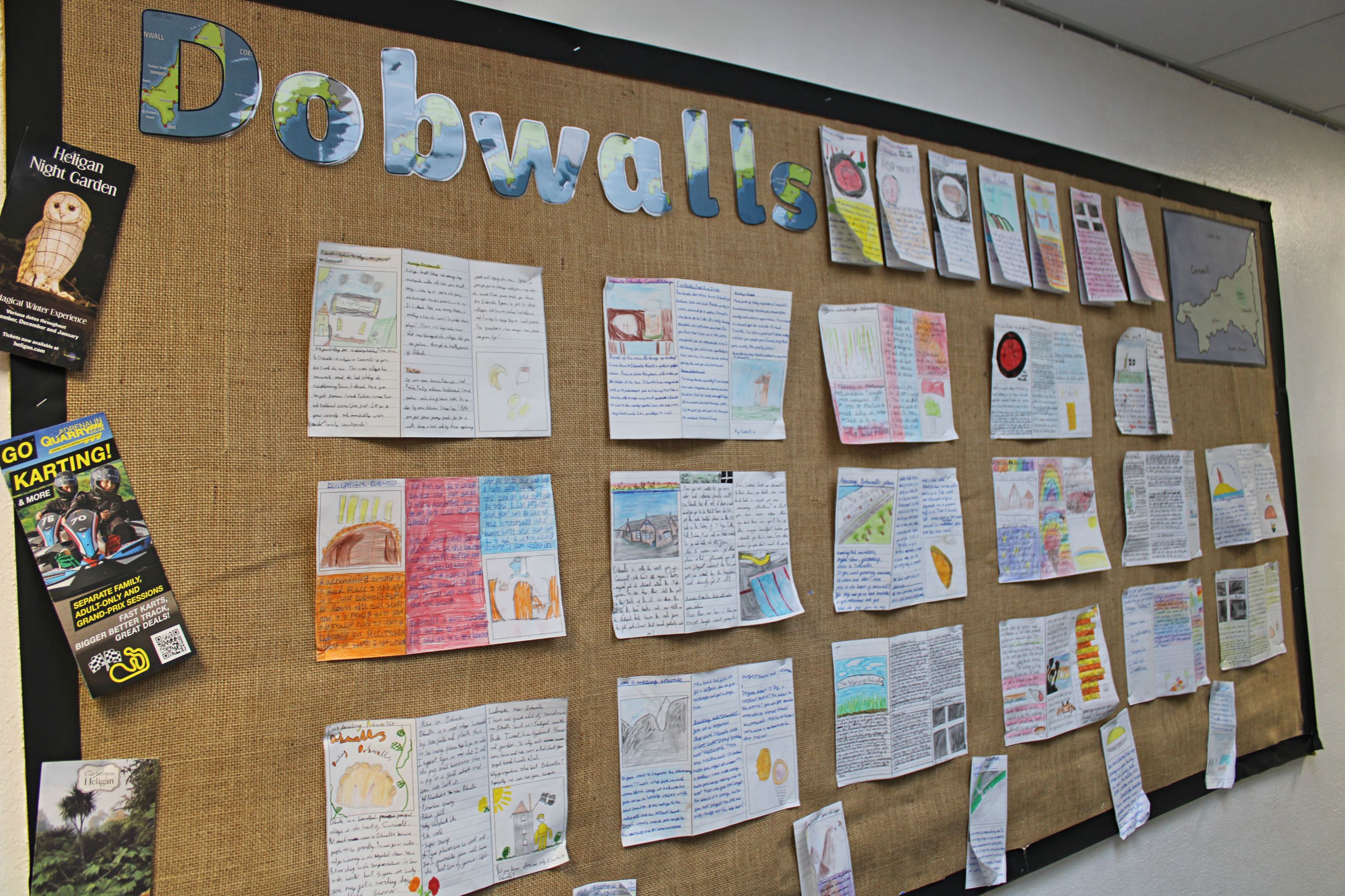 A wall display of children's geography work